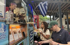 filling orders at the Can Opener, a new food truck park in Durham