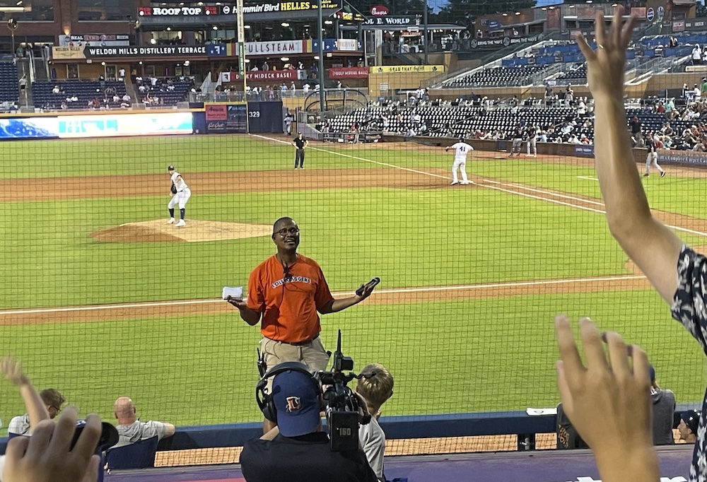 Jatovi McDuffie leads the T-shirt toss at a recent Durham Bulls game.