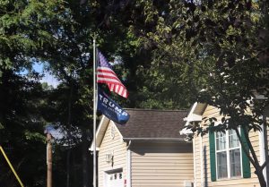 Trump and American flags fly over Harley Walker's house