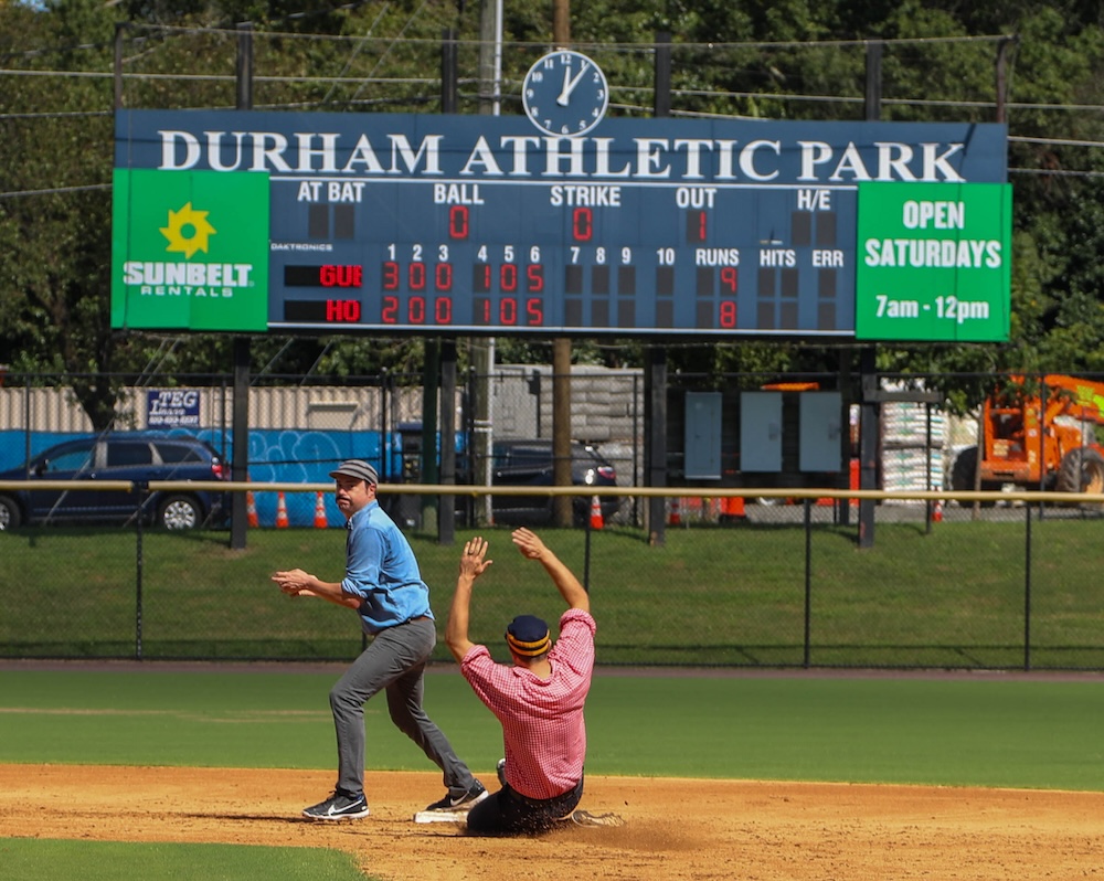 A player slides into second base during a vintage 'base ball' game at Durham Athletic Park