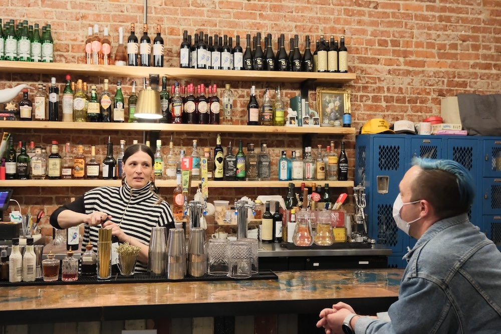 Owner Lindsey Andrews makes a drink for co-teacher Phillip Stillman