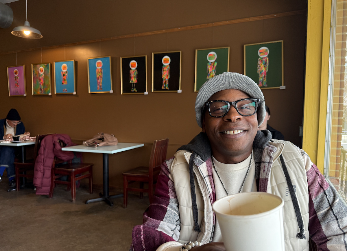 Benjamin Gear working at the Open Eye Cafe