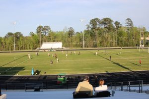 Northern girls soccer team plays on football field