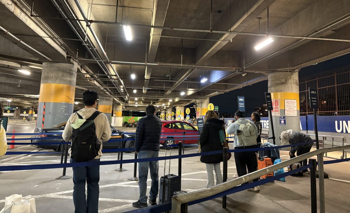 Passengers wait in line for the FlixBus