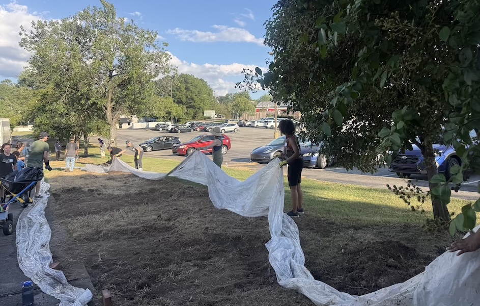 Volunteers prepare the garden for planting