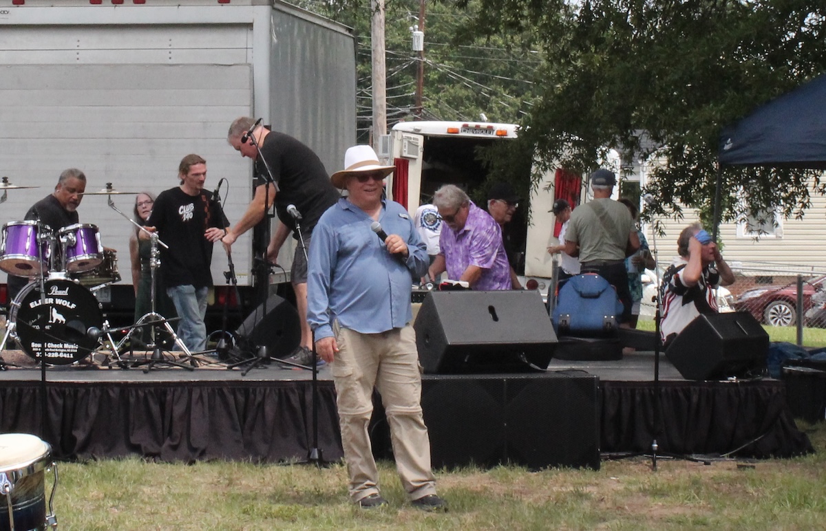 Dave Curro speaks at a festival to raise money for his future community for special needs adults.